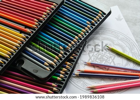 bright colored pencils on a gray background