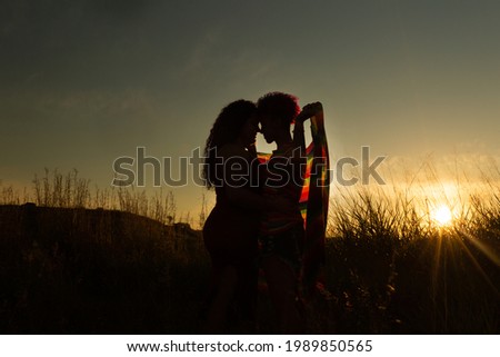 lgbt women couple hugging at sunset