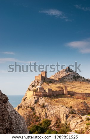 Genoa fortress of the 7th century AD. The city of Sudak. Crimea. Royalty-Free Stock Photo #1989851525