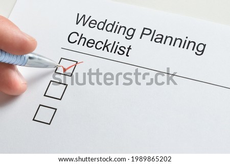 Wedding Planning Checklist. Hand Filling Check List