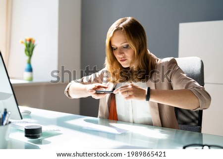 Remote Check Deposit Taking Photo With Mobile Phone Royalty-Free Stock Photo #1989865421