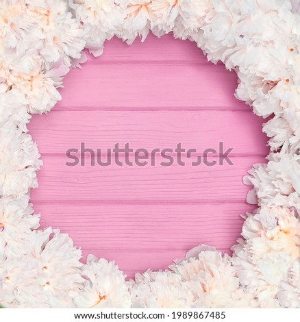 background pink with a border of white peonies on the circle