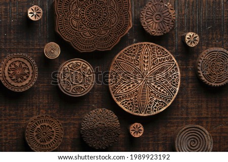 Round shape traditional Indian wood block pattern for textile printing on rustic wood background. Block Printing,Rajasthan India Block Printing,Wood block used for handmade textile printing,Hand craft Royalty-Free Stock Photo #1989923192