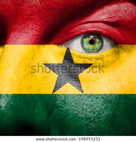 Ghanaian flag painted on a man's face to show support for Ghana