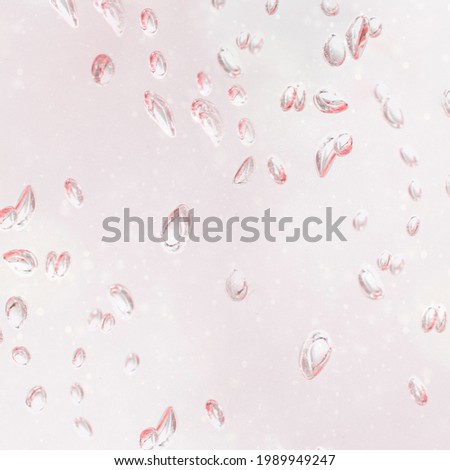 Light pink droplets on a window background