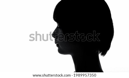 Silhouette of young asian woman opening eyes.