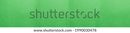 Vintage Green Stucco Wall: Panoramic Wide-Angle Textured Background for Creative Designs