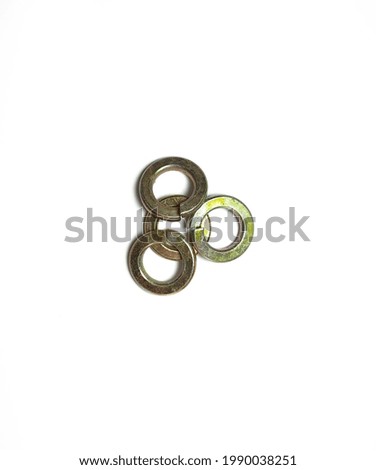 four old rusty spring washers overlap on a white background