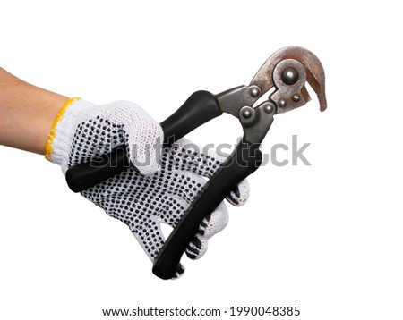 hand in a construction glove holding a vintage diagonal cutter. Isolated on white background.