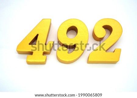  Arabic numerals 492 gold on white background                              