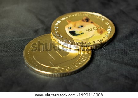 Dogecoin cryptocurrency in close-up on a dark background Royalty-Free Stock Photo #1990116908