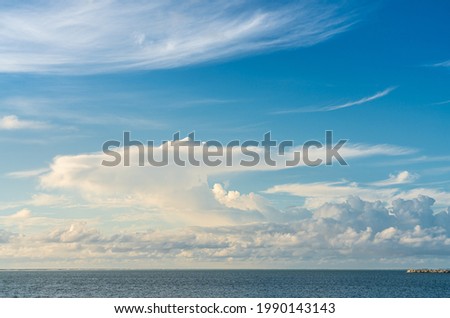 Golden cloudscape and blue sky in Indian ocean, Maldives island