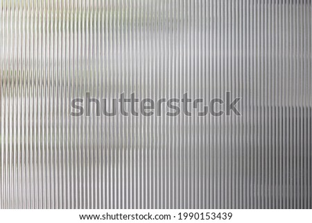 polycarbonate plastic background and texture. Transparent material Corrugated plastic surface use for partition wall or roofing. Royalty-Free Stock Photo #1990153439