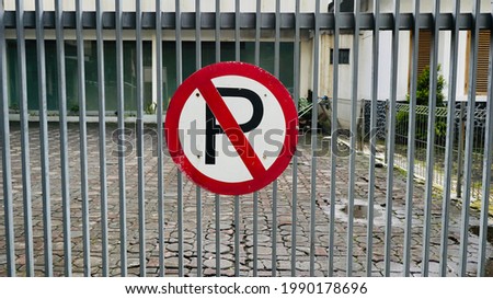 Do not park in front of the fence!