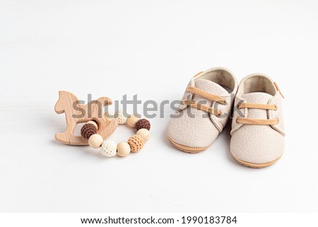 Gender neutral baby shoes and accessories. Organic newborn fashion Royalty-Free Stock Photo #1990183784