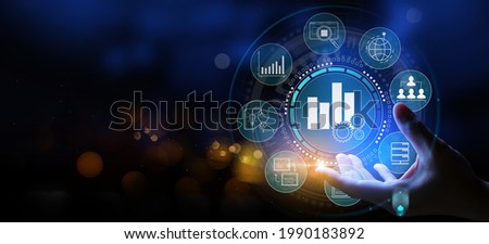 Business hand Worker holding Business analytics Big data analysis technology future concept on VR screen on blur background. Royalty-Free Stock Photo #1990183892