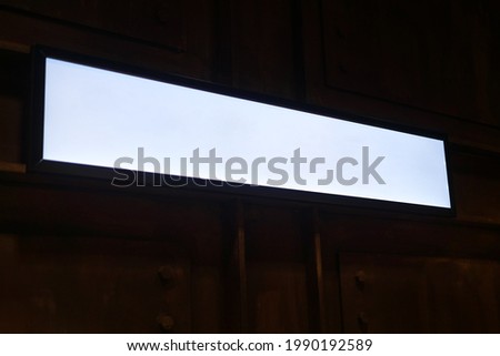 Mock-up of white long rectangle shape on wooden background