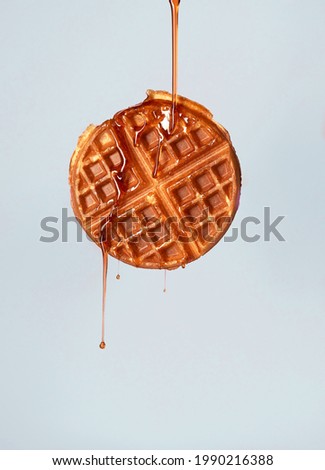 waffle newly made and bathed in honey Royalty-Free Stock Photo #1990216388