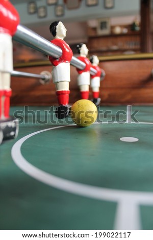 Foosball football in red team colours Soccer Table top stock, photo, photograph, picture, image