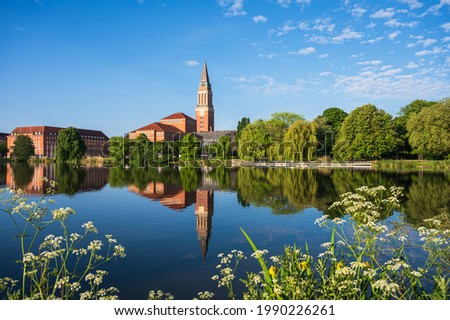 Kiel, Germany, Jun 12, 2021 In the center of Kiel the Hiroshimapark with the pond "Kleiner Kiel", the old town hall and the opera house in the morning light Royalty-Free Stock Photo #1990226261