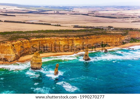 Australia. The Twelve Apostles and Great Ocean Road. Gorgeous Ocean Turquoise Surf. Picture taken from a helicopter. The concept of extreme, active and photo tourism
