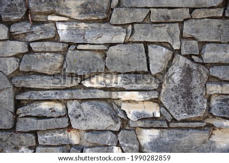 Close-up full frame view of a section of a natural rock wall