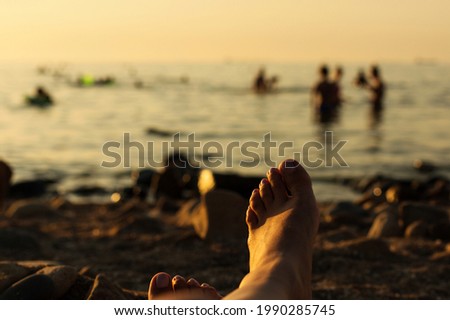 RUSSIA, YEYSK - 19 August 2016: People in the Kamenka beach at sunset. Russia, Sea of Azov, Krasnodar Territory, Yeysk.