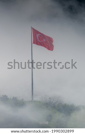 A turkish flag in the fog