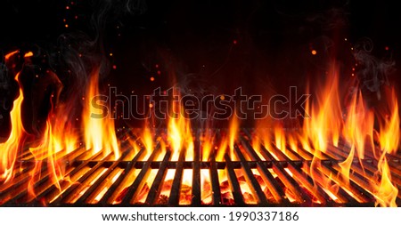 Barbecue Grill With Fire Flames - Empty Fire Grid On Black Background Royalty-Free Stock Photo #1990337186
