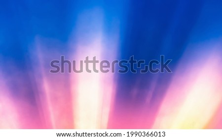 pink and orange sun beam light in deep blue sky, abstract sky