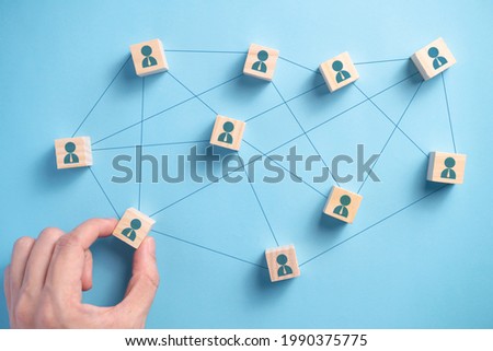 Wooden block with people icon teamwork business group. Connection networking business concepts. Royalty-Free Stock Photo #1990375775