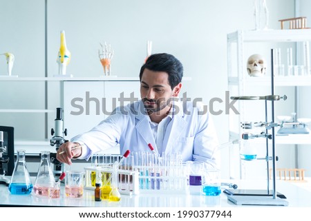 Medical Development Laboratory: Male Scientist Looking Vaccine, Professionals Working in Advanced Scientific Lab doing Medicine, Vaccine, covid-19 vaccine development
