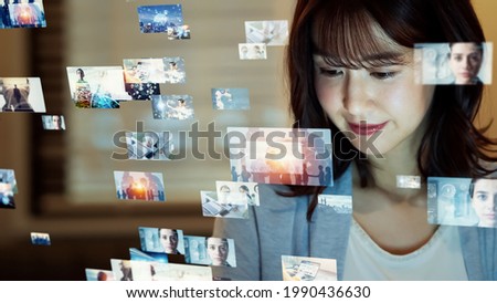 Asian woman watching hologram screens. Visual contents concept. Social networking service. Streaming video. communication network.