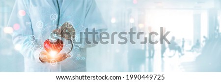 Medical business and health insurance, Medicine doctor with  stethoscope holding red heart shape and medical insurance icon on global network connection, hospital, Service and Healthcare business Royalty-Free Stock Photo #1990449725