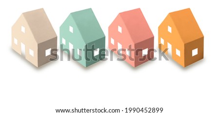 The concept of mortgage and rental housing and real estate. Mortgage credit lending. Multicolored scattered paper houses on a white isolated background. Banner format. Copy space