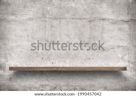 empty shelf on concrete wall