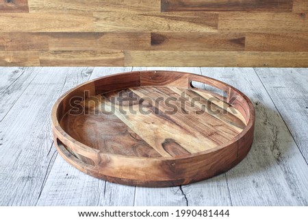 A studio photo of a wooden coffee tray