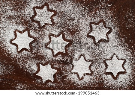 sugar stars on wooden background