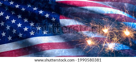 USA Independence day concept.Blurry of American Flag on blue cement background With Fireworks.