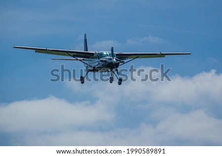 close-up of Cessna Grand Caravan 208B G-CPSS light aircraft, flaps down on final approach to land, Wiltshire UK