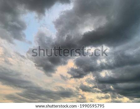 Big gray stratocumulus clouds With the air moving up and down in the same way as the waves and when the weather rises, it creates a layer of clouds up into the beautiful sky at Thailand Royalty-Free Stock Photo #1990595795