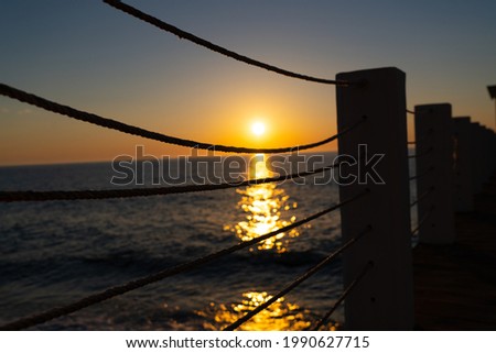 sunset on the Black Sea, view from the pier
