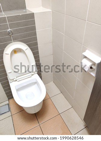 view interior of public toilet 