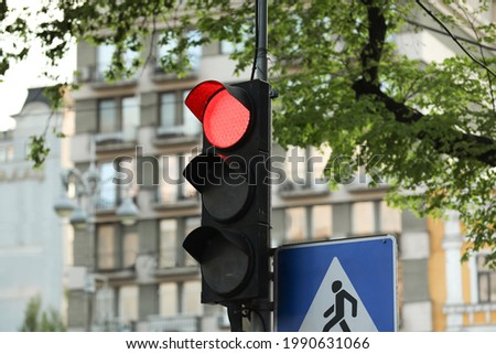 View of traffic light in city on spring day