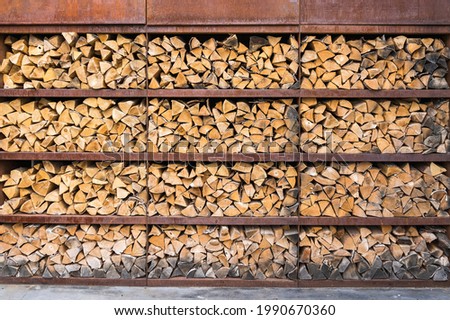 Firewood prepared in a woodpile. One way to properly store firewood