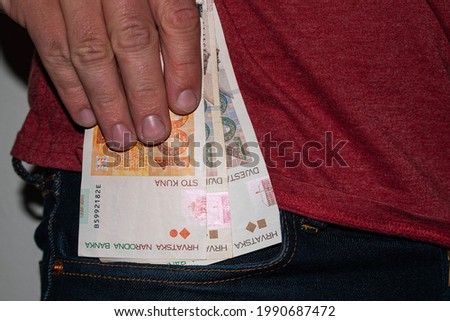 Croatian kuna banknotes in jeans pocket Royalty-Free Stock Photo #1990687472