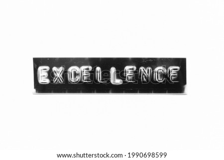 Embossed letter with word excellence in black banner on white paper background