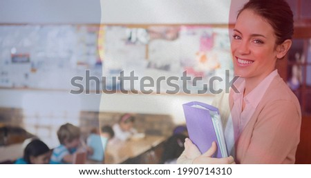 Composition of french flag over smiling female teacher with children in classroom. school, education and study concept digitally generated video.