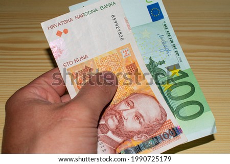 Euro and croatian kuna bills. HRK and EU Royalty-Free Stock Photo #1990725179