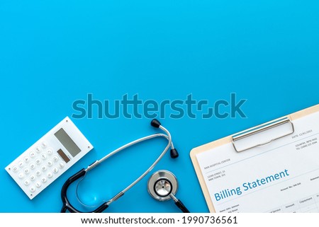Stethoscope with medical billing statement. Top view